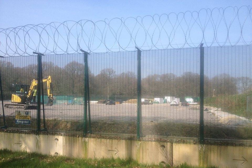 A machine is developing oils from the underground enclosed by 358 high security fence with a razor wire topping.