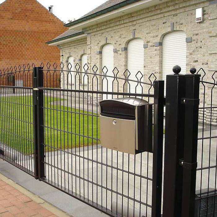 Double wire fence is used to create boundaries for parking lots.