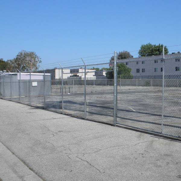 Galvanized chain link fences are installed surround the industrial zone.