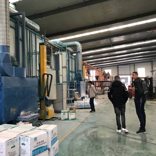 Some customers are visiting the powder spraying production line of security fence.