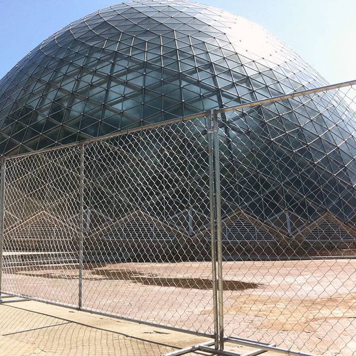 Temporary chain link fence is used to create a temporary boundary for shopping mall.